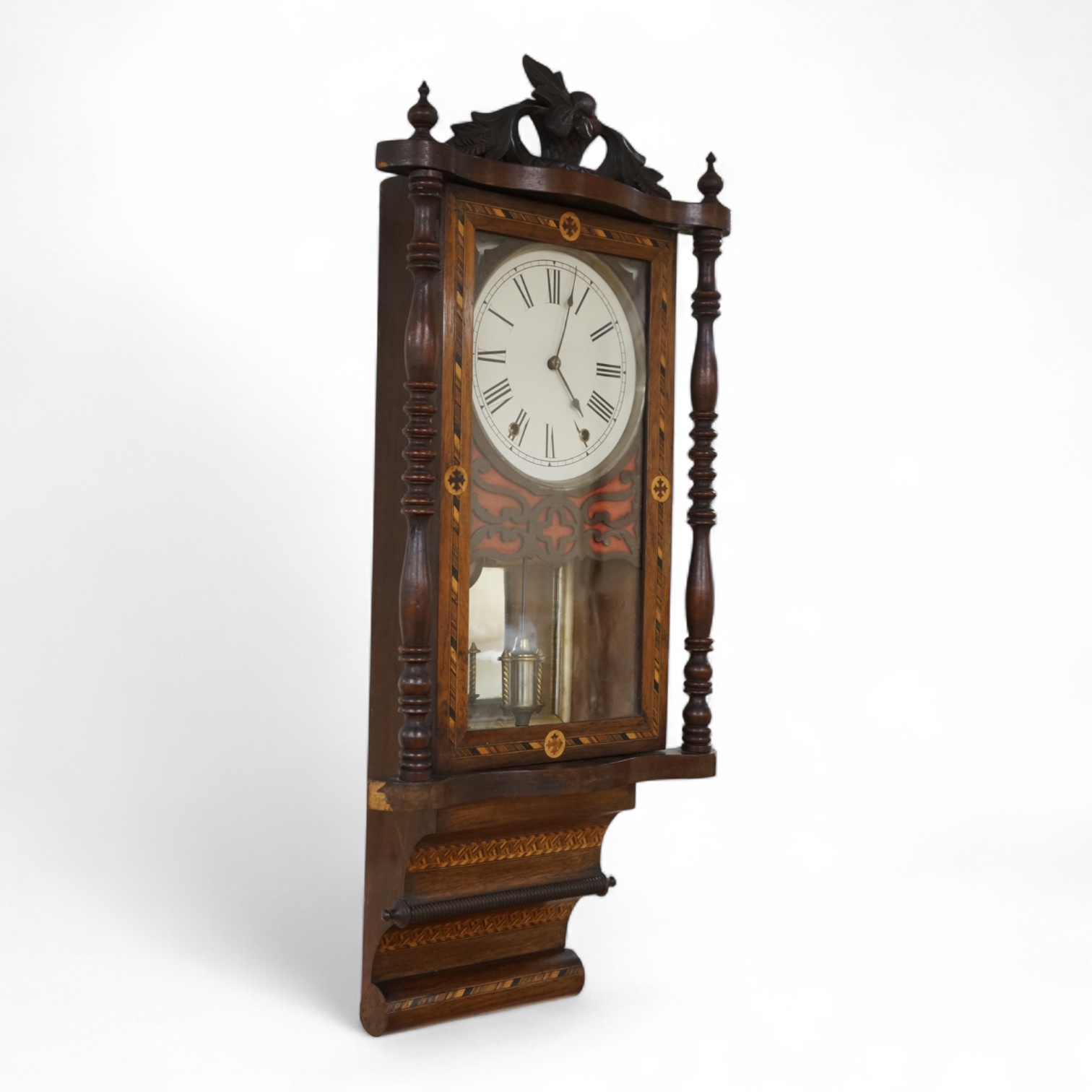 A German inlaid walnut wall clock, 84cm high, with pendulum.